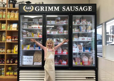 child in front of cabinet